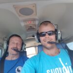 Justin and his dad flying a plane.