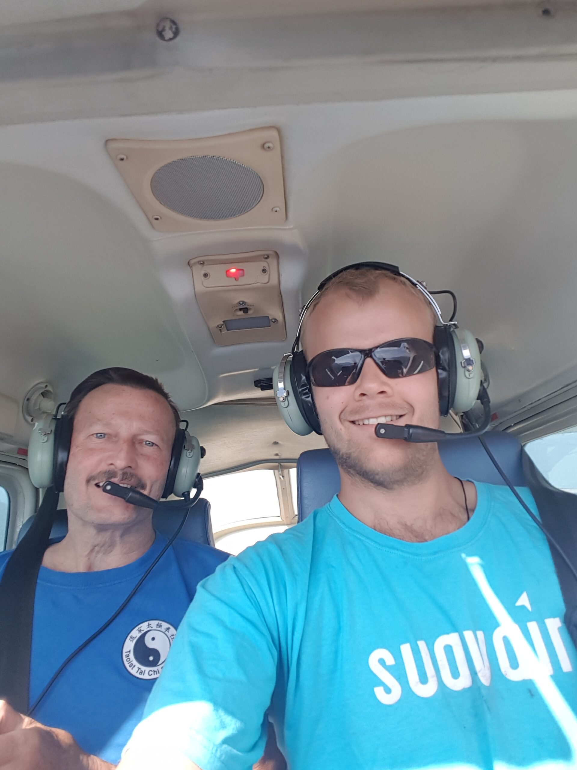 Justin and his dad flying a plane.