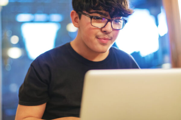 High school student studying at a computer