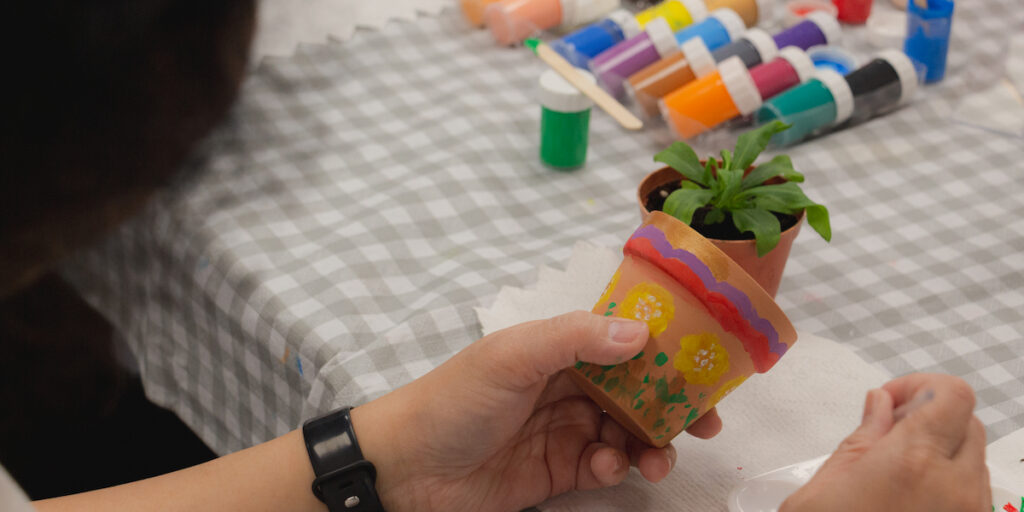 Pot painting activity at BCIT Library, May 2025. Photo by Shiny Kuo.