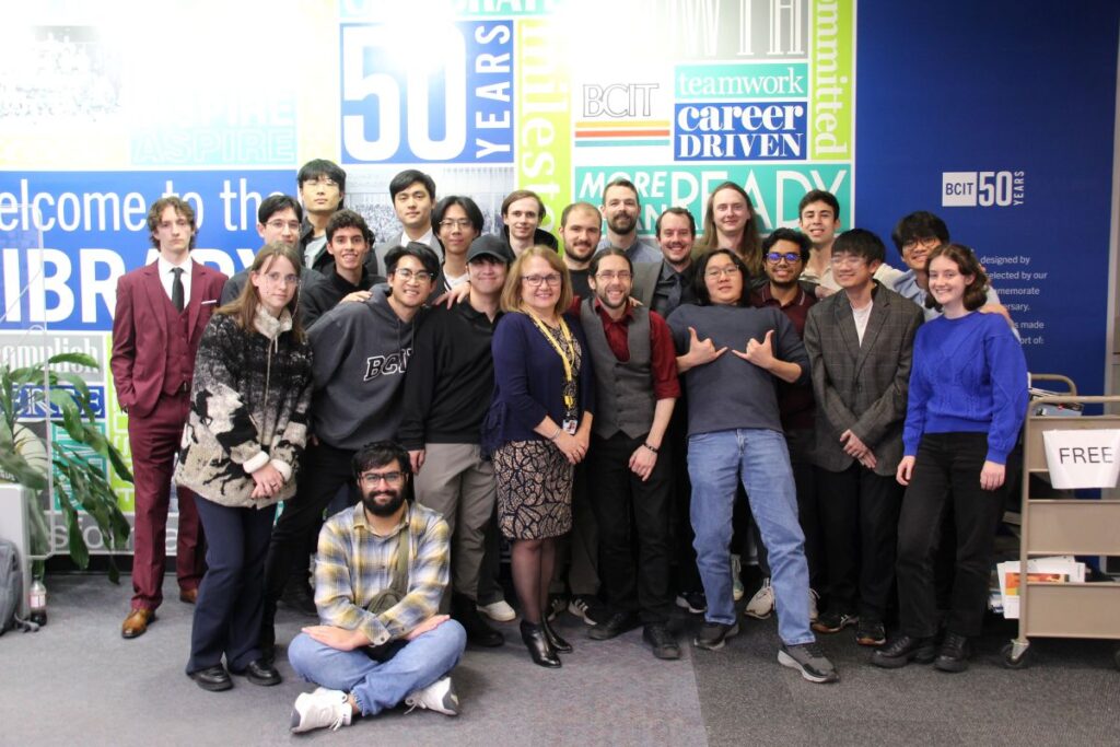 Group of about 25 computing students and faculty Dr. Mirela Gutica