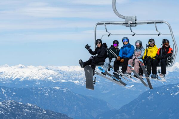 Happy people going to ski and snowboard