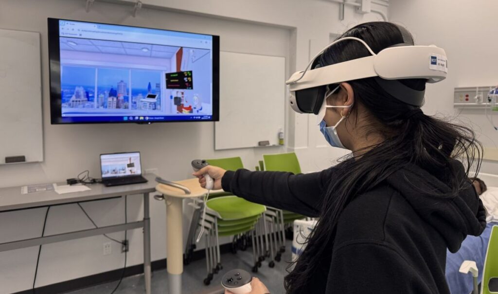 Nursing student uses a VR headset at BCIT Burnaby