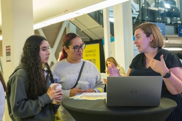 Academic advisor talks to applicants about their potential program options.