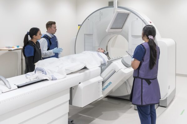 Nuclear medicine students at work in a hospital.