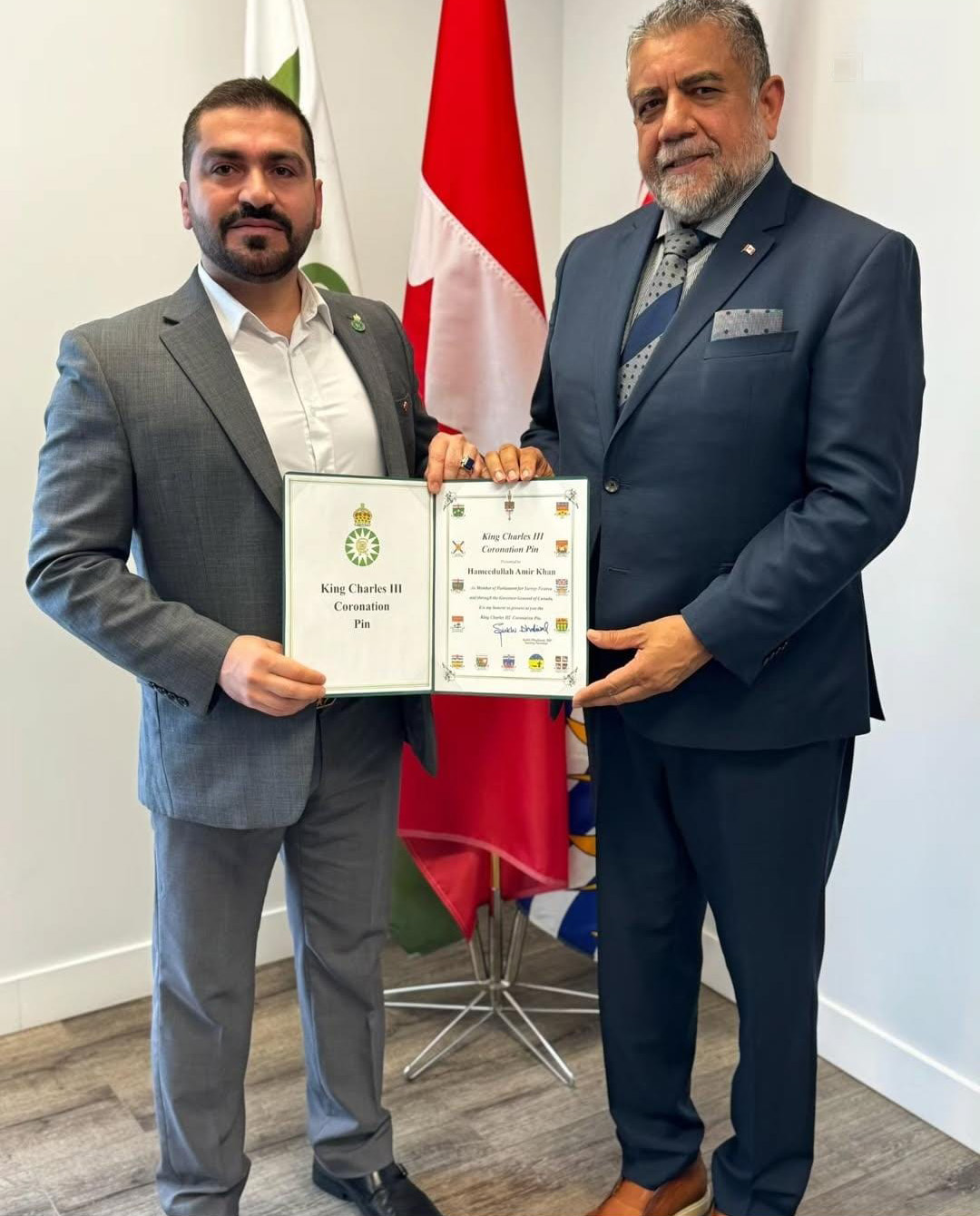 Hameed Khan receiving King Charles III Coronation Pin