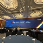A large screening in at a conference in a ballroom setting