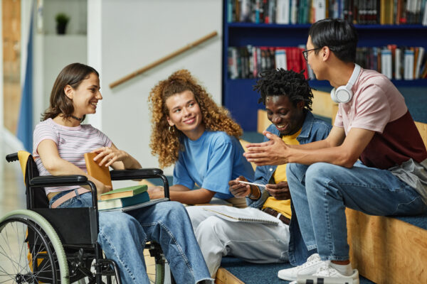 Image of diverse students working together on campus.