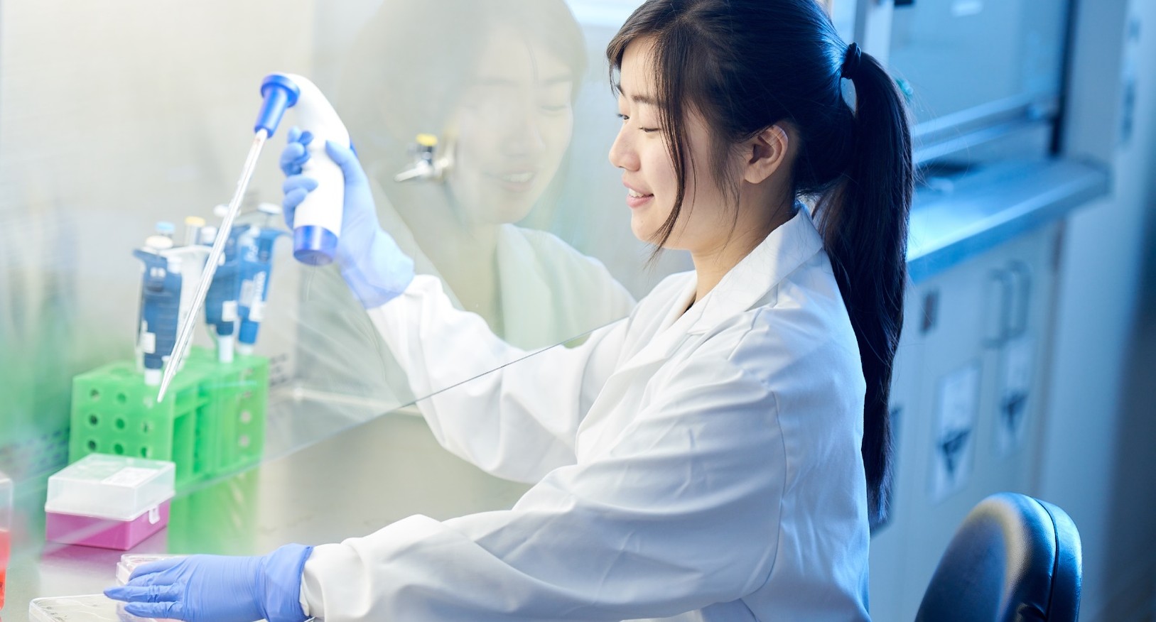 A biotechnology student works in a lab
