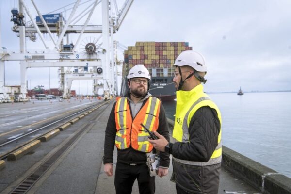 Canadian Armed Forces veteran works in a port in the field of global trade and transportation management.