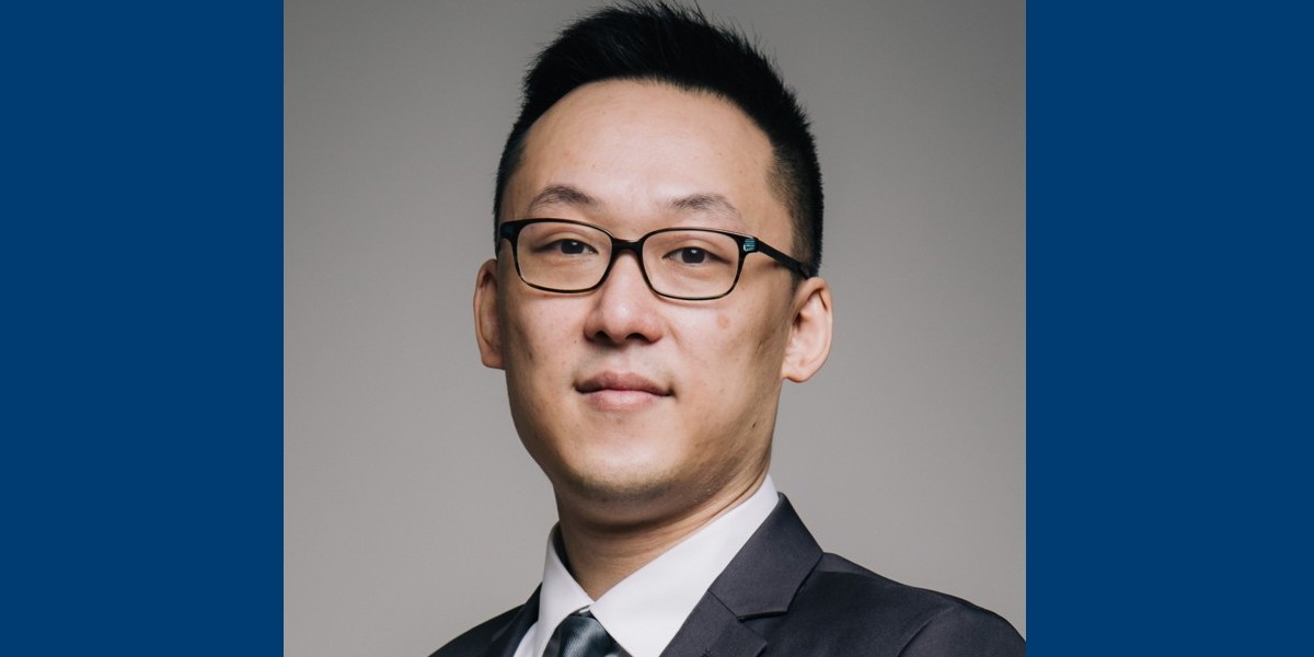 Marco Ho wearing a suit