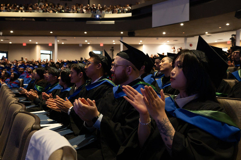 Grad students clapping